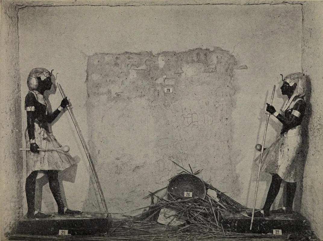 Figures guarding the sealed doorway to Tut's sepulchral chamber