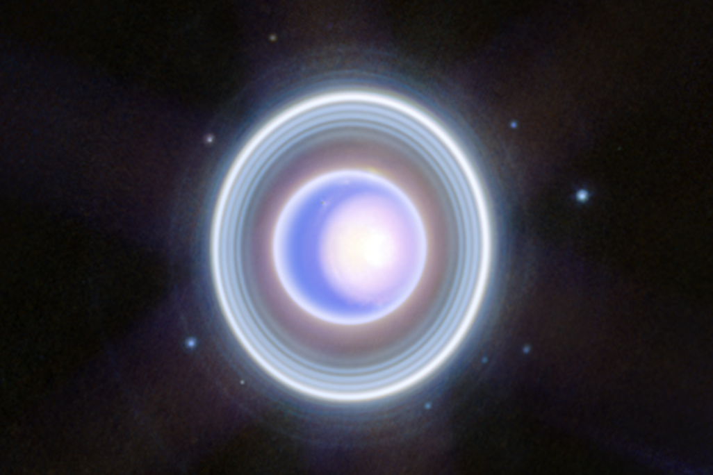 Uranus appears blue-purple with lots of rings around it and nine dots, which are its moons
