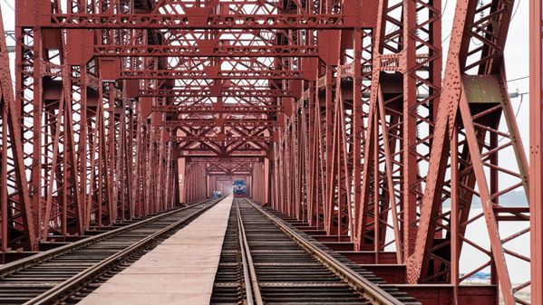 A train Coming through a big bridge thumbnail