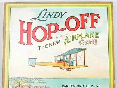 This Parker Brothers game features a Vickers Vimy on the "Lindy" game box and board—the aircraft in which British aviators John Alcock and Arthur Brown made their non-stop transatlantic flight in 1919. Perhaps a similar game existed before Lindbergh's solo flight in his Ryan monoplane. 
