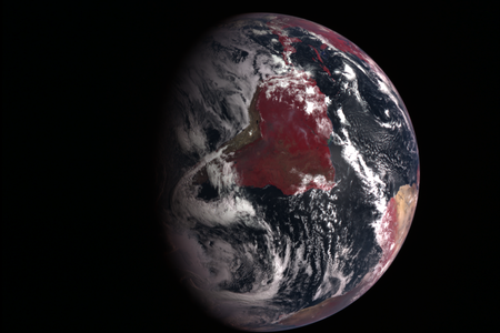 An abundance of life: Plant-covered land is red in this combined visible light/infrared view of Earth from the Messenger spacecraft.