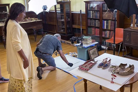 Leola One Feather, of the Oglala Sioux Tribe in South Dakota, observes as Native American artifacts are photographed in Barre, Massachusetts.&nbsp;