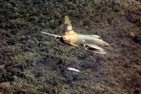 A North American F-100D Super Sabre drops a napalm bomb near Bien Hoa, South Vietnam, 1967.