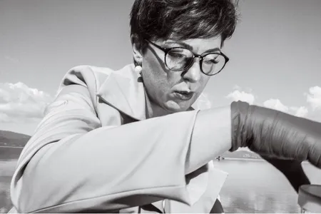 Paola Magni in 2022, taking a water sample from Italy&rsquo;s Lake Bracciano&mdash;the site of the mysterious death of a local teenager, ten years before.