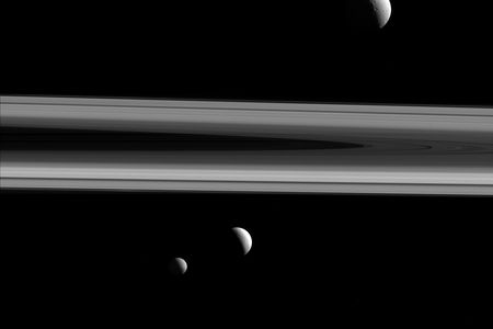 NASA's Cassini spacecraft captures three of Saturn's moons—Tethys, Enceladus and Mimas—in this group photo.