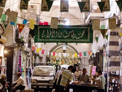 "Syria, Souk of Aleppo"

In the Souk of Aleppo, with a Mamluk portal leading to a courtyard to the right, 2008
