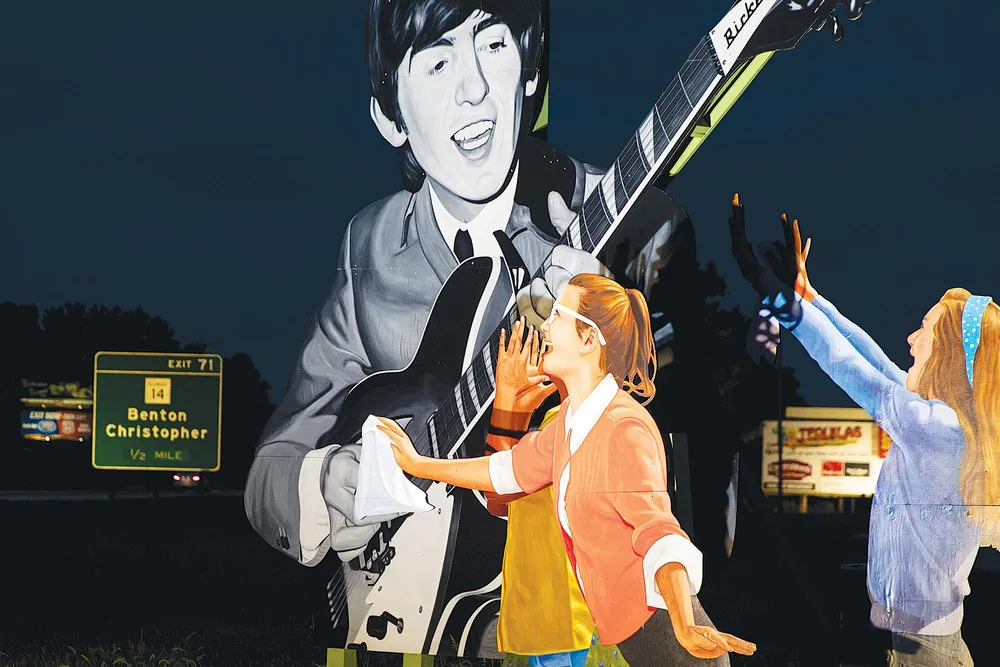 OPENER - A billboard near Benton, Illinois. The rock n roller from Liverpool was un- known in the States when he visited the town in 1963.