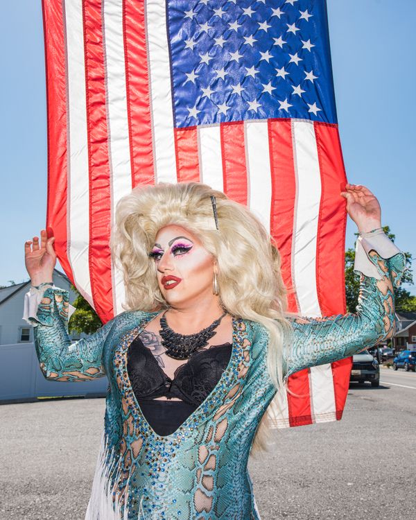 Drag queen Haley Hemorrhoid with the American flag thumbnail