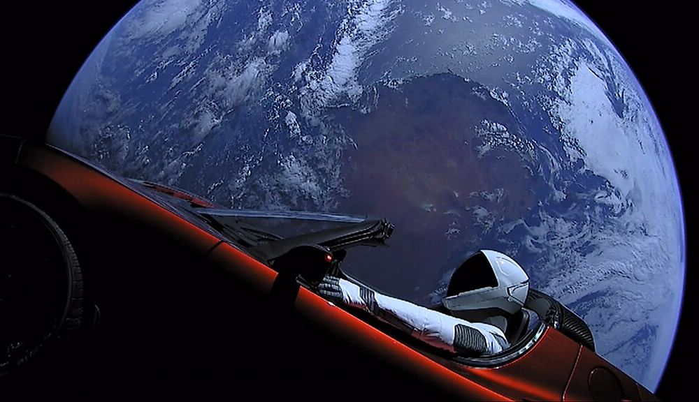 Elon Musk's Tesla Roadster on the Falcon rocket, with Earth in background