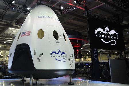 CEO & Chief Designer Elon Musk unveils the new SpaceX's Dragon V2 spacecraft Thursday evening at SapceX HQ. The Dragon V2 is the next generation spacecraft designed to carry astronauts into space.