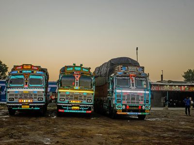 Brightly colored trucks are parked near the village of Murthal, a popular stopping place for weary travelers in search of a good meal.