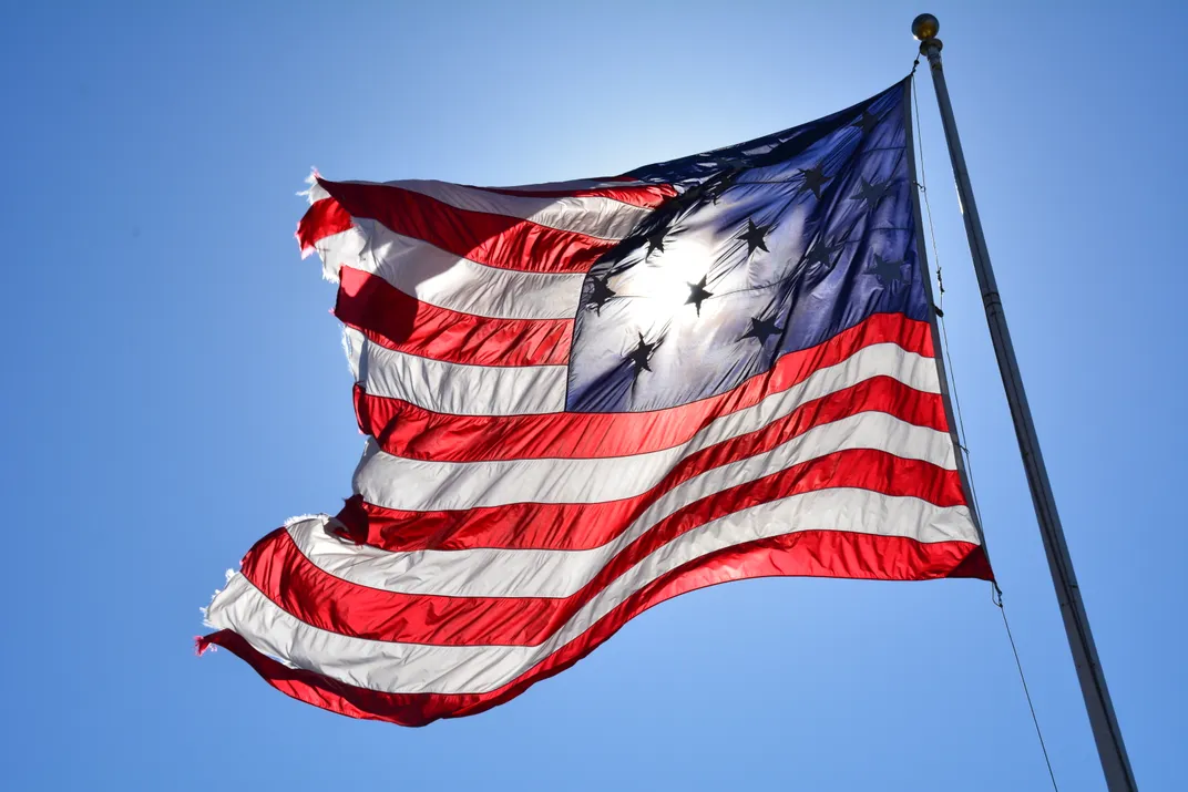 3 - An American flag blows in the wind at Federal Hill Park in Baltimore.