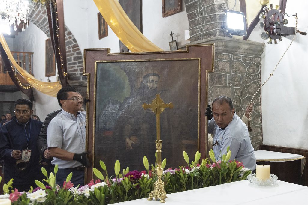 Men carrying a painting