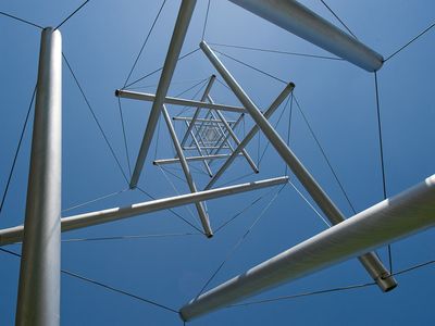 Those who see Needle Tower often wonder how, with barely 14 inches of contact with the ground, the 60-foot tower stays upright. 

