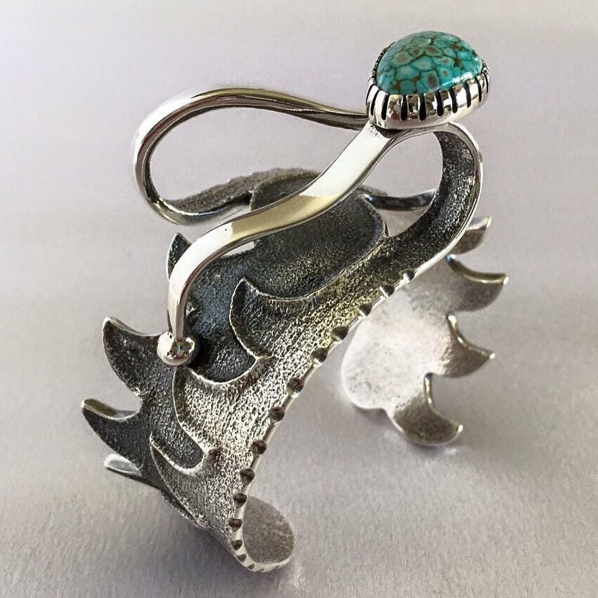 Silver jewelry by Monty Claw.