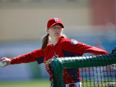 Justine Siegal pitching for the Cardinals during batting practice in 2011