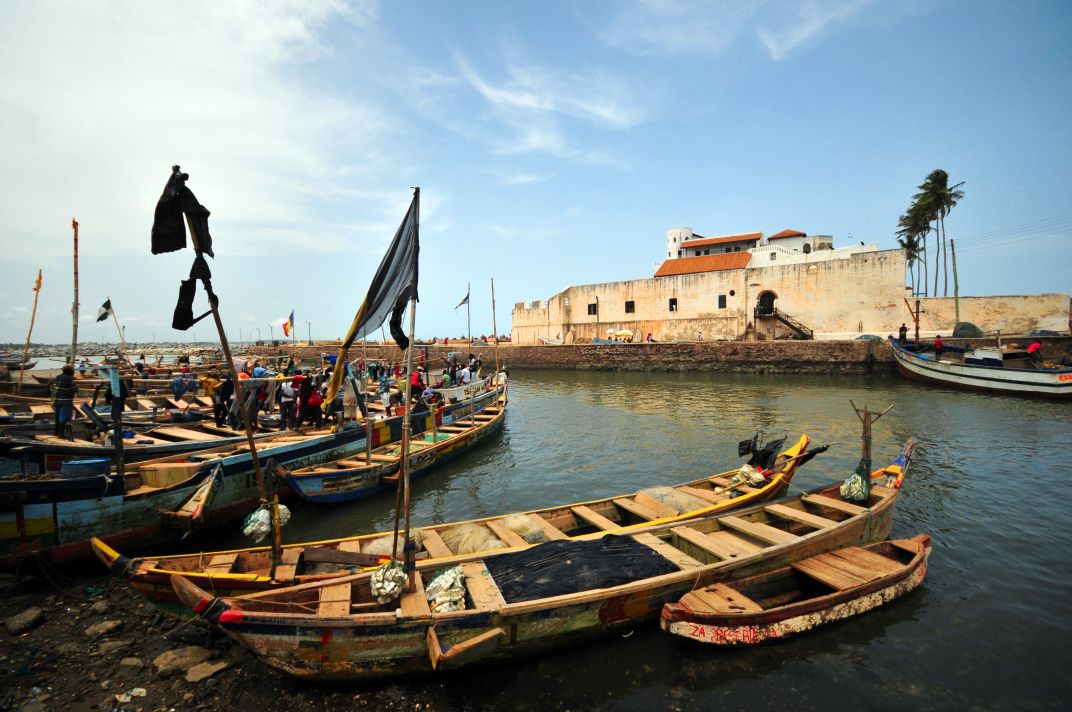 Fishing boats in front of Elmina Castle on Ghana's southern coast