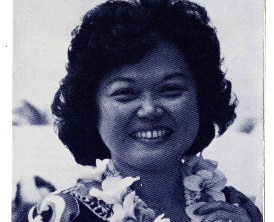 Patsy T. Mink wears a lei and smiles