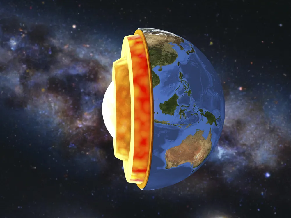 A artist's rendering of a cutaway showing the four layers of the Earth