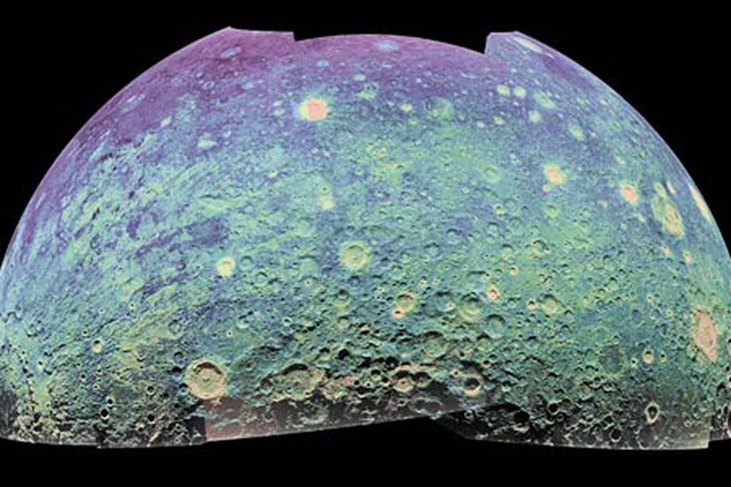 The color-coded mosaic is oriented as if the viewer were hovering directly above the lunar South Pole,which lies at the bottom center. In some areas of the surface, the 70-centimeter wavelength penetrates up to 100 feet.