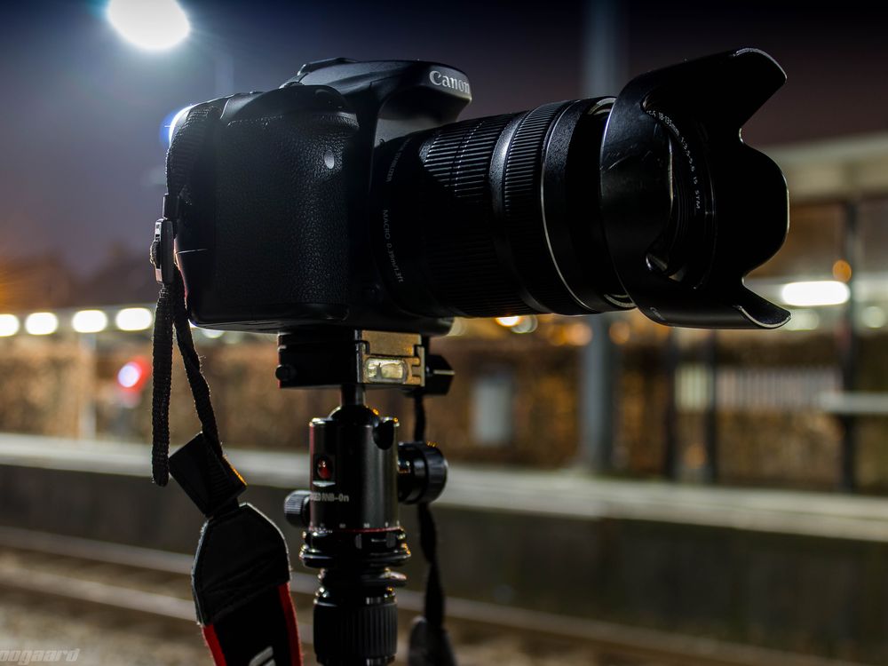 An image of a Canon camera resting on a tripod