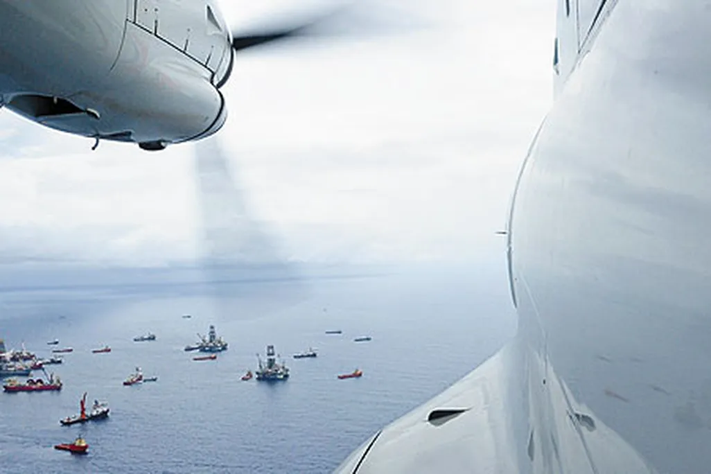 From the cockpit of a Coast Guard HC-144 patrol plane, the armada surrounding the deep water horizon rig last June appears placid.