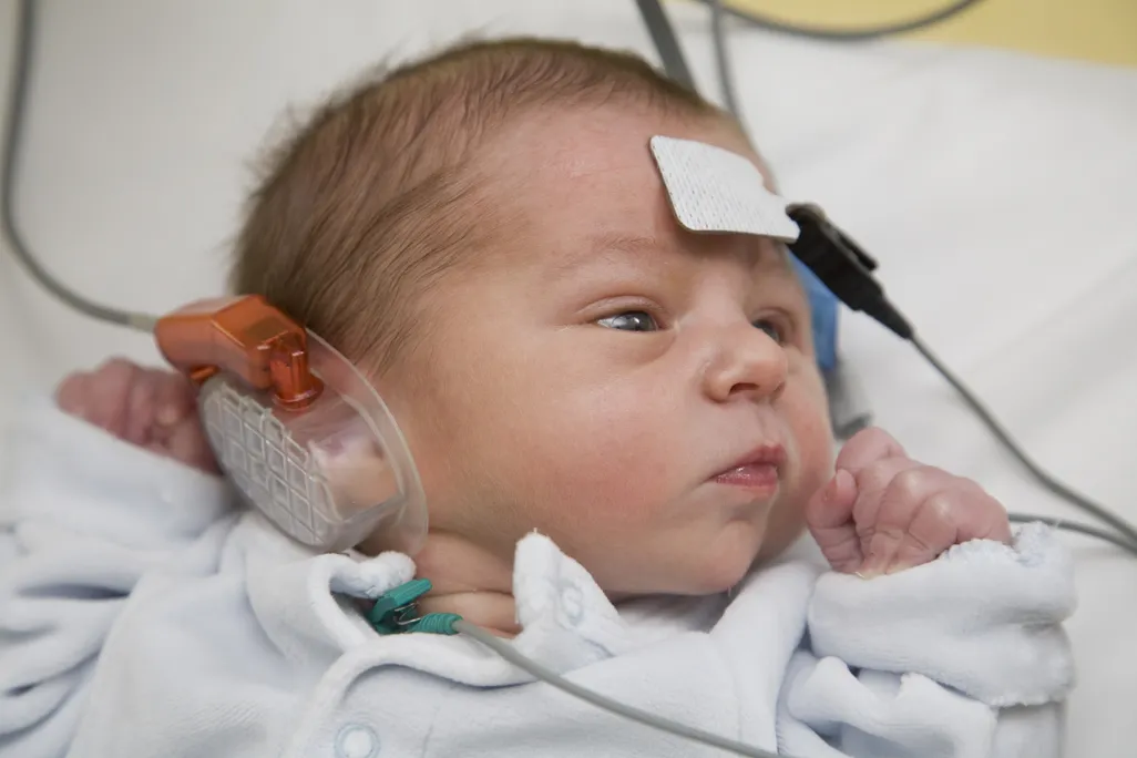 a baby doing a hearing test
