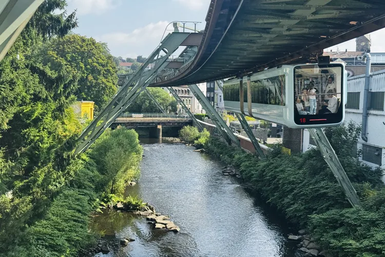 One of the most unusual public transportation systems in the world, the train hangs from an elevated steel track.