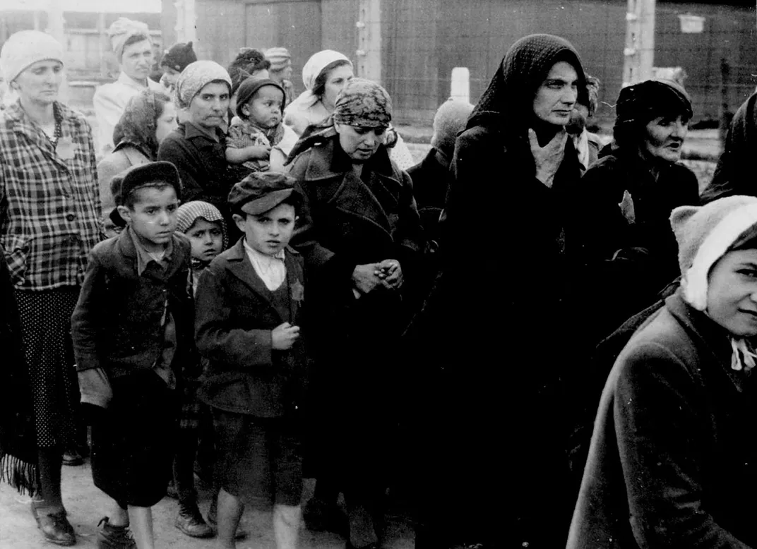 Jewish women and children walk to the gas chambers at Auschwitz