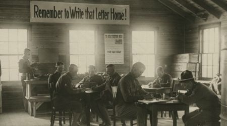 World War I soldiers writing letters home