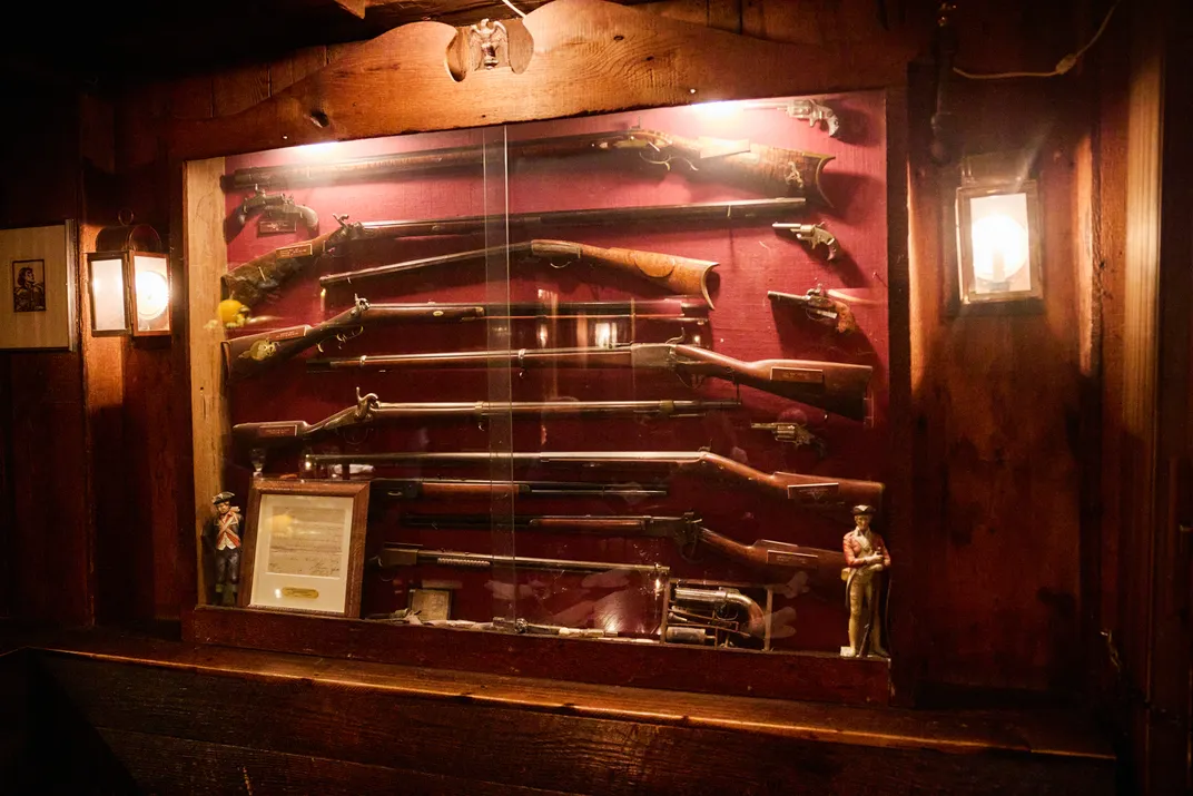 In one of the dining rooms, antique firearms sit proudly on display.