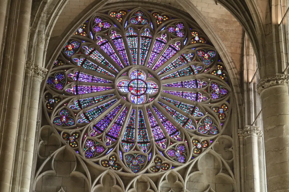 The church edifice in the old walled city of Carcassonne, France was once the cathedral of the diocese. This rose window appealed to me.
