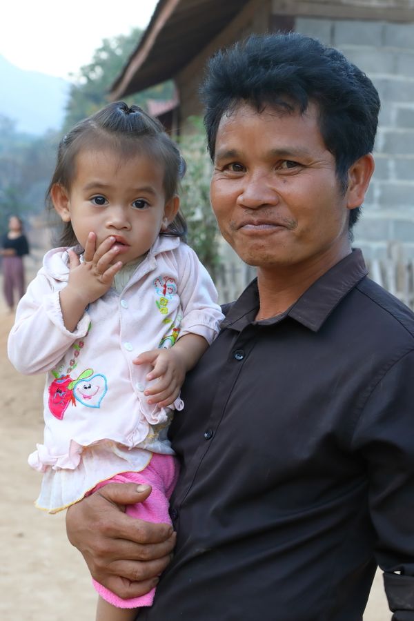 Man with Daughter in Ban Kok Fark Village, Laos thumbnail
