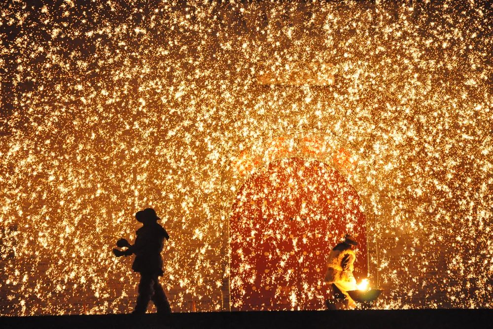 Da Shuhua is a 500-year-old tradition that involves throwing molten iron (heated to more than 2,900 degrees) against a frozen wall to create a spectacle similar to fireworks. ​​​​​​​