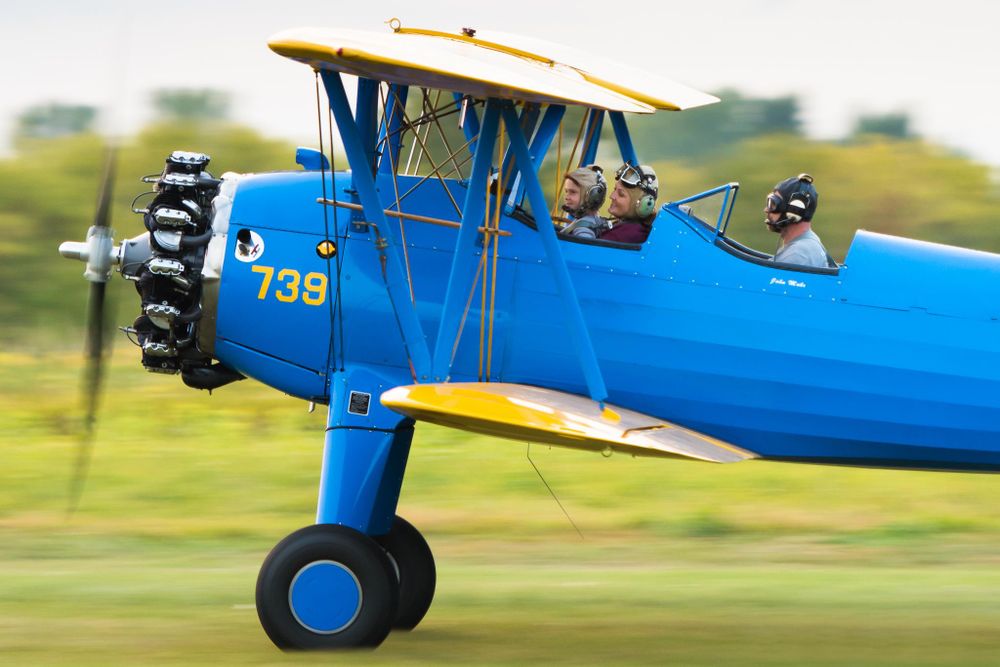 people in a blue aircraft
