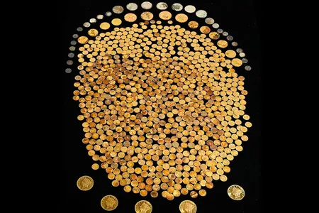 The 700-plus gold coins, found in a cornfield in Kentucky, date to between 1840 and 1863.
