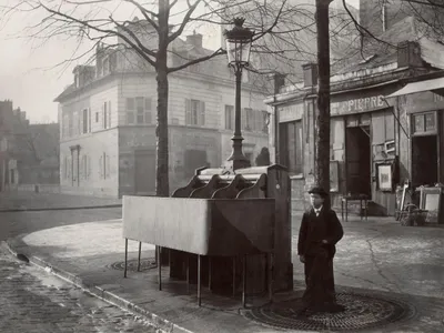 Photographer Charles Marville captured this snapshot of an open-air urinal with three stalls in 1865.