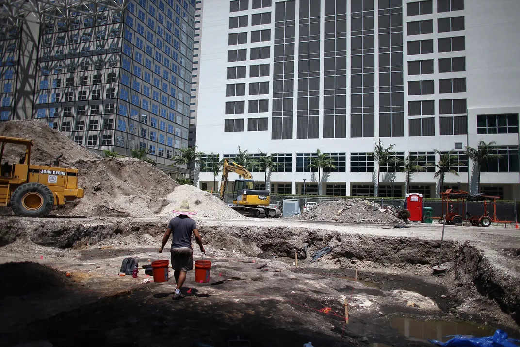 Archaeologists excavate the site of a Tequesta village at the mouth of the Miami River in May 2013.