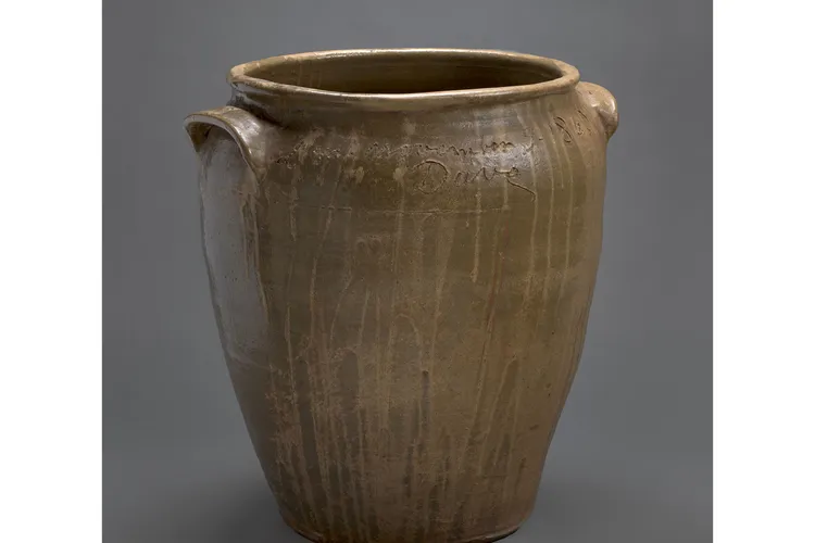 Inscribed brown-green vessel