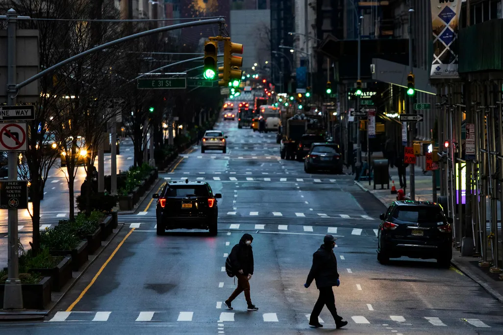 People cross Park Avenue after it was announced that some streets will be closed off as lockdown continues in response to the coronavirus outbreak on March 27, 2020 in New York City.