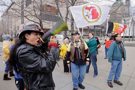 Philip Yenyo, executive director of the American Indian Movement for Ohio, leads a protest of the Cleveland Indians Chief Wahoo mascot before a baseball game against the Detroit Tigers Friday, April 10, 2015, in Cleveland.