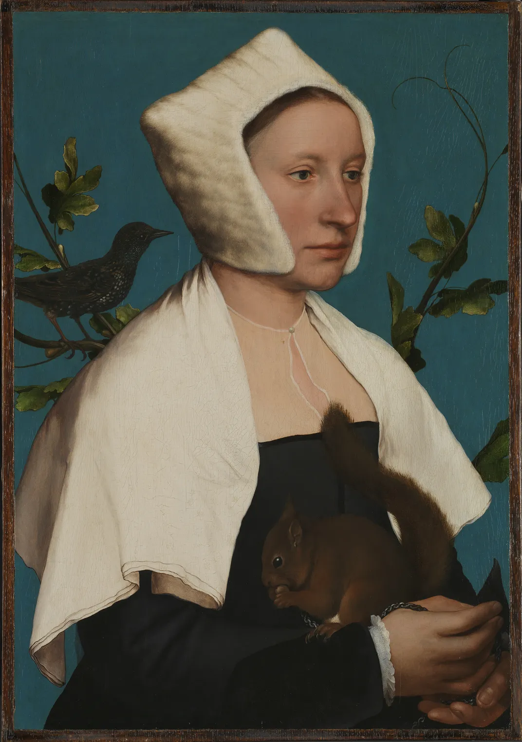 A portrait of a pale woman holding a small red squirrel in front of a blue-green background, with a starling (bird) perched over her right shoulder