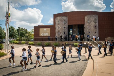 Garfield Elementary's award-winning drumline performs with the cheerleading squad in celebration of the Anacostia Community Museum's 50th anniversary.