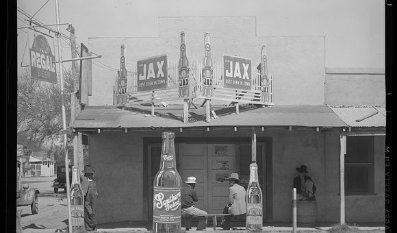 Black and white photograph of a the façade of a Mexican beer hall in Texas.