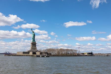 The Statue of Liberty and the new museum building on Liberty Island as seen from the approach by ferry.