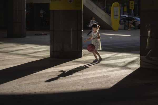 Little girl playing basketball thumbnail