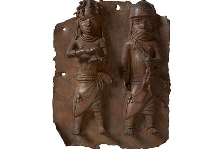 A plaque depicting a war chief and a royal military priest carrying a leather gift box