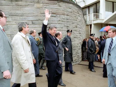 President Ronald Reagan, pictured waving to a crowd shortly before John Hinckley Jr. tried to assassinate him on March 30, 1981