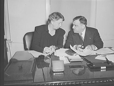 Mrs. Eleanor Roosevelt and Mayor Fiorello H. La Guardia in the latter's office in Washington on the occasion of Mrs. Roosevelt's being sworn in as Mayor La Guardia's assistant in the Office of Civilian Defense.