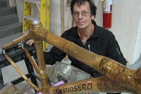 Legendary bicycle builder Craig Calfee working on a handmade bamboo bicycle.